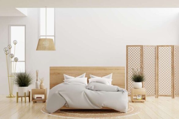 Bright Scandinavian bedroom featuring a unique, multi-branched brass floor lamp acting as a wall light feature.